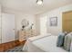 Bright bedroom featuring hardwood floors and stylish decor with a white color scheme at 2057 Cambridge Ave, Atlanta, GA 30337