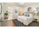 Main bedroom boasts hardwood floors, a modern rug, and multiple closets at 2057 Cambridge Ave, Atlanta, GA 30337