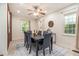 Stylish dining room featuring seating for six, modern lighting, and cozy window at 2057 Cambridge Ave, Atlanta, GA 30337