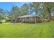 Traditional brick home with a neatly landscaped front yard and mature trees at 2057 Cambridge Ave, Atlanta, GA 30337