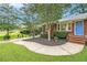 Eye-catching brick home with mature landscaping and a curved walkway at 2057 Cambridge Ave, Atlanta, GA 30337