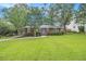 Charming brick home featuring a well-manicured lawn and inviting blue front door at 2057 Cambridge Ave, Atlanta, GA 30337