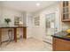 Bright kitchen space boasting granite countertops, tile floors, and additional breakfast area at 2057 Cambridge Ave, Atlanta, GA 30337