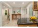 Spacious kitchen area featuring granite countertops, tile floors, ample lighting, and extra workspace at 2057 Cambridge Ave, Atlanta, GA 30337