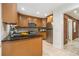 Charming kitchen with stainless steel appliances, granite countertops, and brick accents at 2057 Cambridge Ave, Atlanta, GA 30337