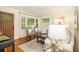 Bright living room with modern decor, hardwood floors, and a charming entry door at 2057 Cambridge Ave, Atlanta, GA 30337