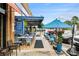 Charming outdoor seating area featuring bistro-style tables, umbrellas, and comfortable chairs, ideal for enjoying meals al fresco at 2057 Cambridge Ave, Atlanta, GA 30337