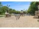 Well-maintained playground area with wooden play structures and lush trees at 2057 Cambridge Ave, Atlanta, GA 30337