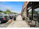 Street view showcasing a commercial area with parked cars, sidewalks, and outdoor seating, perfect for local business access at 2057 Cambridge Ave, Atlanta, GA 30337