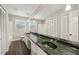 Bathroom featuring a long vanity, dual sinks and tile flooring at 2466 Country Club Dr, Conyers, GA 30013