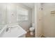 Bathroom featuring a shower, toilet, vanity with quartz countertop and decorative tile flooring at 2466 Country Club Dr, Conyers, GA 30013