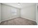 Bedroom featuring carpet, neutral walls, trim, natural light and closet at 2466 Country Club Dr, Conyers, GA 30013