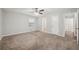 Spacious bedroom featuring carpet, a ceiling fan, closet, and an ensuite bathroom at 2466 Country Club Dr, Conyers, GA 30013