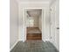 Entryway boasts slate floors leading into a carpeted living area with shuttered doors at 2466 Country Club Dr, Conyers, GA 30013