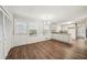 Eat-in kitchen space with laminate floors, white cabinets, and access to backyard at 2466 Country Club Dr, Conyers, GA 30013