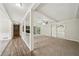 Open living space featuring wood floors, a brick fireplace, and access to outdoor patio at 2466 Country Club Dr, Conyers, GA 30013