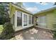 Inviting sunroom featuring large windows and access to a brick patio perfect for outdoor relaxation and entertaining at 2466 Country Club Dr, Conyers, GA 30013