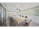 Bright sunroom with lots of windows, carpet flooring, and ceiling fan at 2466 Country Club Dr, Conyers, GA 30013