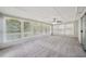 Sunroom with carpet, neutral siding, and lots of natural light from numerous windows at 2466 Country Club Dr, Conyers, GA 30013