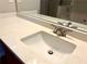 Close up of white bathroom sink with modern faucet and bright countertop at 3884 Grovemont Pl, Duluth, GA 30096