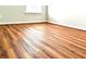 Bedroom with wood floors and natural light from one window at 3884 Grovemont Pl, Duluth, GA 30096