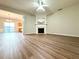 Spacious living room with hardwood floors and fireplace at 3884 Grovemont Pl, Duluth, GA 30096