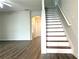 Staircase with wood treads and white risers, leading to the upper level at 3884 Grovemont Pl, Duluth, GA 30096