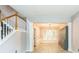 Open dining room with staircase, light fixture, and built-in shelving providing ample space at 5077 Wellisford Ct, Suwanee, GA 30024