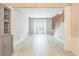 A bright, open living room with neutral tones, tile flooring, and a window seat at 5077 Wellisford Ct, Suwanee, GA 30024