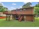 Backyard with upper wooden deck and lower level at 115 Elizabeth Way, Ellenwood, GA 30294