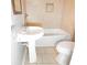 Bathroom with a pedestal sink, framed mirror, tile floor, and a shower/tub combo at 115 Elizabeth Way, Ellenwood, GA 30294