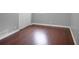 Cozy bedroom featuring a closet and hardwood floors and painted with a neutral paint color at 115 Elizabeth Way, Ellenwood, GA 30294