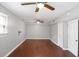 Spacious bedroom features hardwood floors and two ceiling fans at 115 Elizabeth Way, Ellenwood, GA 30294