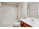 Bathroom with a shower-tub combo, single sink vanity, and tiled backsplash at 2040 Village Green Dr, Fairburn, GA 30213