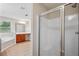 Primary bathroom featuring a separate shower and soaking tub for ultimate relaxation at 2040 Village Green Dr, Fairburn, GA 30213