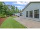 Backyard featuring well-maintained lawn and exterior of light blue home at 4322 Braden Nw Ln, Kennesaw, GA 30144