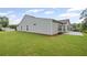 Spacious backyard with a concrete patio and view of the light blue home at 4322 Braden Nw Ln, Kennesaw, GA 30144