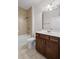 Bathroom showcasing vanity, toilet, and shower with tile surround at 4322 Braden Nw Ln, Kennesaw, GA 30144