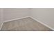 Neutral walk-in closet space with carpeted flooring and white wire shelf at 4322 Braden Nw Ln, Kennesaw, GA 30144