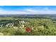 An aerial view shows the property's location within a community surrounded by trees and foliage at 700 Walkingstick Dr, Douglasville, GA 30134