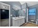 Bathroom boasts a large mirror, double sink vanity and plenty of natural light at 700 Walkingstick Dr, Douglasville, GA 30134