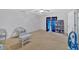 Spacious bedroom with ceiling fan, sitting area, and carpet flooring at 700 Walkingstick Dr, Douglasville, GA 30134