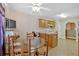 Light eat-in kitchen with central island, neutral countertop and flooring, plus breakfast table at 700 Walkingstick Dr, Douglasville, GA 30134