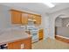Well-lit kitchen featuring wood cabinets, light countertops and breakfast bar for casual dining at 700 Walkingstick Dr, Douglasville, GA 30134