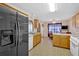 Spacious kitchen with modern appliances, adjacent breakfast table and sleek black refrigerator at 700 Walkingstick Dr, Douglasville, GA 30134