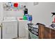 Laundry room with standard washer and dryer, shelving, and storage at 700 Walkingstick Dr, Douglasville, GA 30134