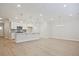 Open concept kitchen featuring stainless appliances, modern lighting, and dining area at 905 Agate Ln, Lawrenceville, GA 30043