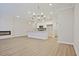 Modern living room and kitchen space with fireplace at 905 Agate Ln, Lawrenceville, GA 30043