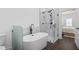 Bright bathroom features a glass shower, modern fixtures and a freestanding tub at 173 Brush Creek Ct, Stockbridge, GA 30281