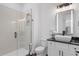 Elegant bathroom features a glass-enclosed shower, vessel sink, and modern lighting at 173 Brush Creek Ct, Stockbridge, GA 30281